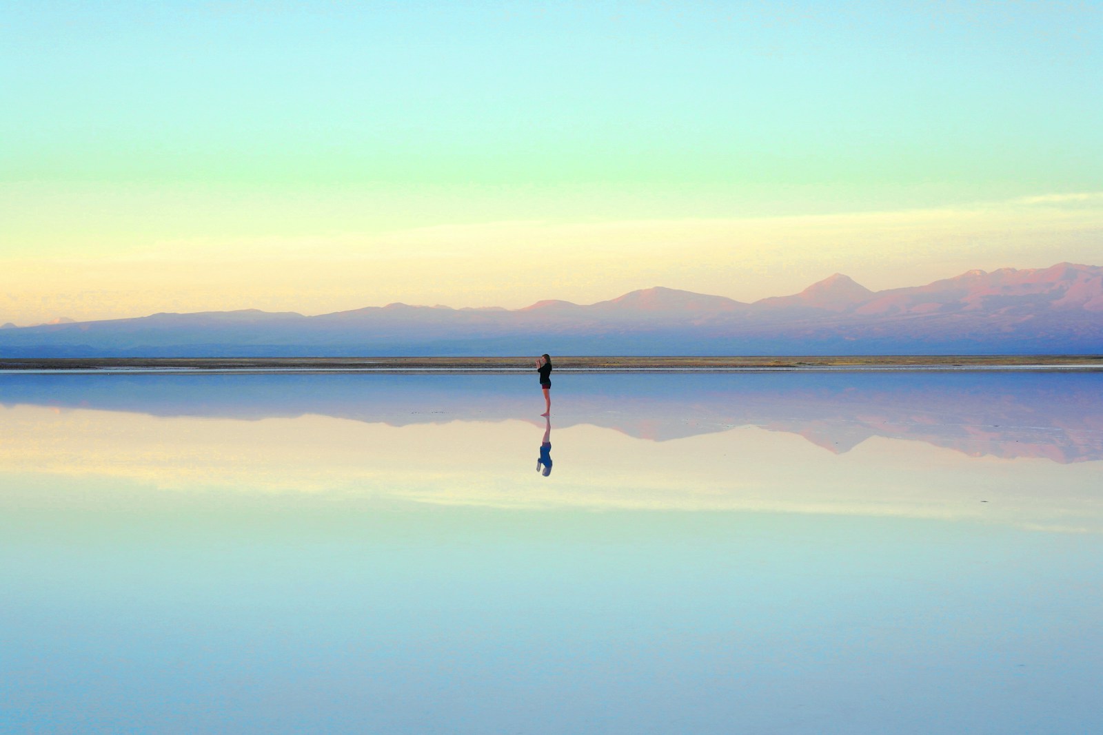 person standing near body of water during daytime